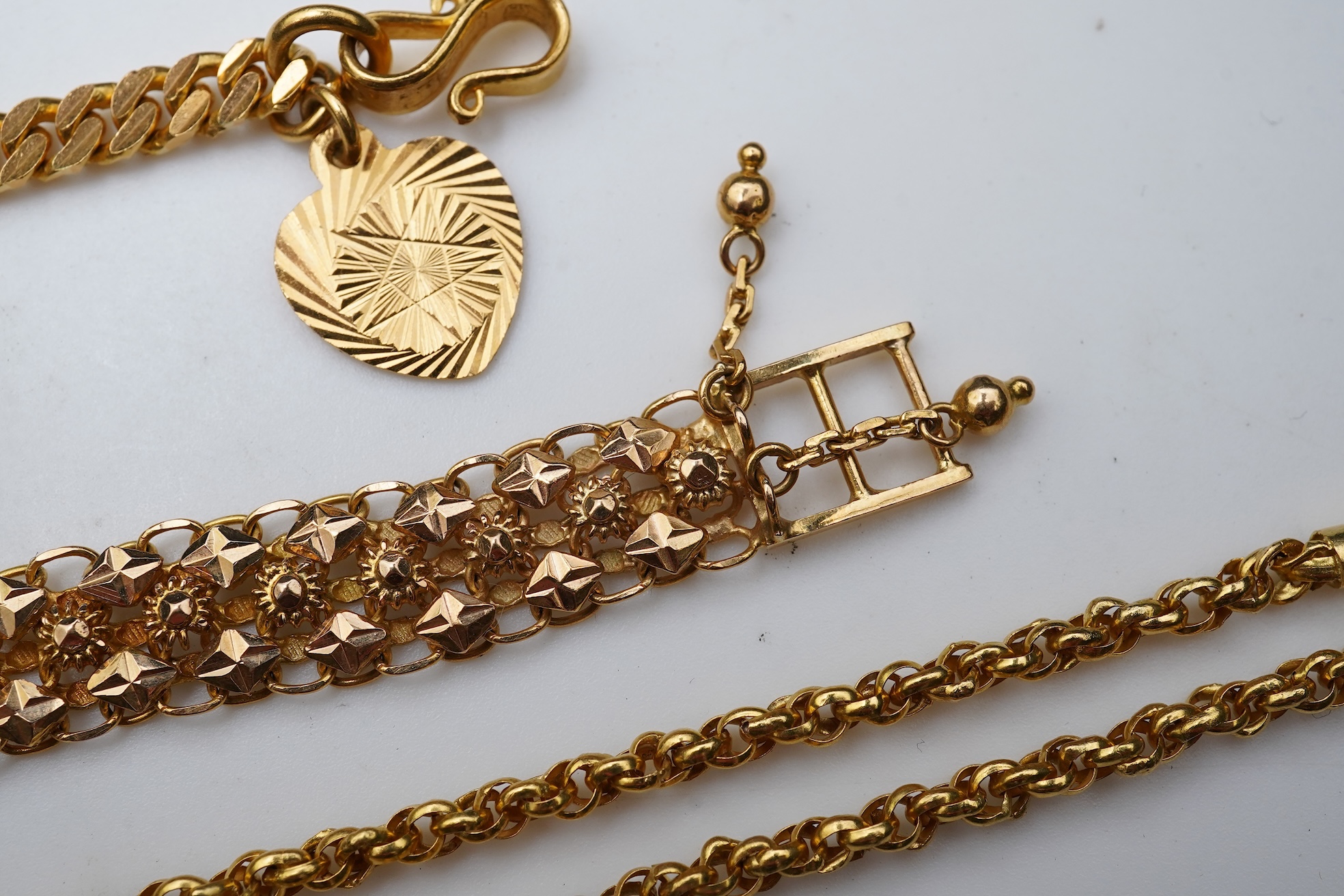 A Chinese pendant necklace and two gold bracelets
